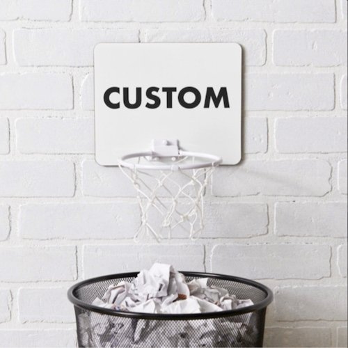 Personalized custom Mini Basketball Hoop pictured on wall over waste basket.