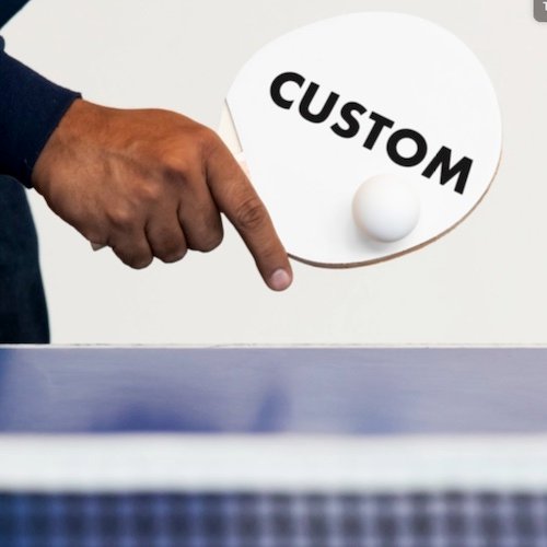 Personalized custom Table Tennis Ping Pong Paddle being held by player.