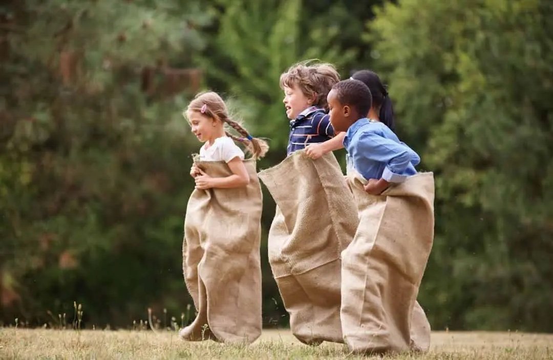 Kid's sack race - traditional party games.