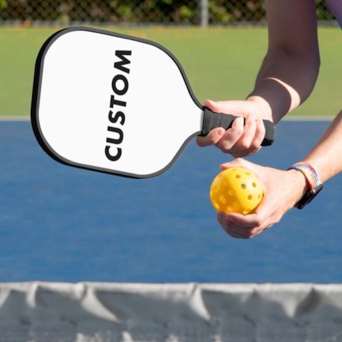 Personalized custom Pickleball Paddle BLACK handle and trim being played Personalized custom Pickleball Paddle BLACK handle and trim being played.