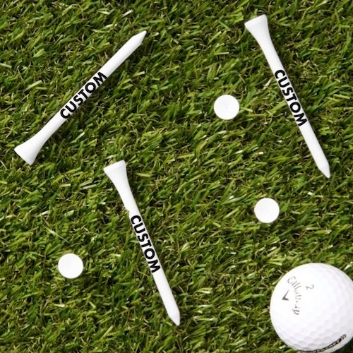 Personalized custom Golf Tees - WHITE wood tees with golf ball on grass.